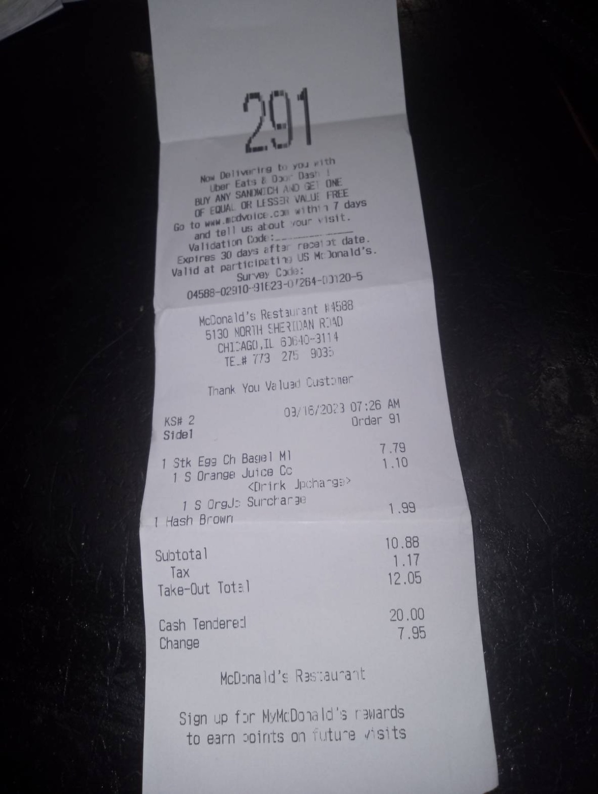 A $12.05 McDonald's take-out receipt paid with a $20 bill, $7.95 change